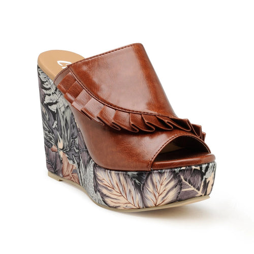 Our Classic open toe wedges from our 'Pleats Please' collection. Tan pleated upper in slip-on style, with an abstract tropical print. Featuring a 4-inch high wedge heel crafted from state of the art materials.